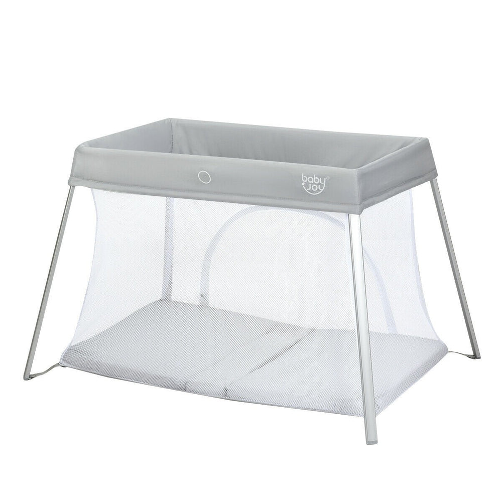Baby Joy foldable travel crib with breathable mesh sides and silver metal legs in light gray for budget-friendly travel