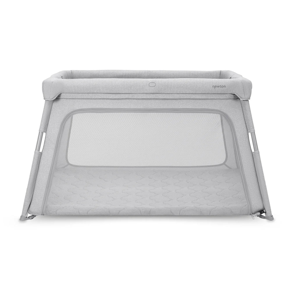 Newton Baby travel crib and play yard in light gray with breathable mesh sides and padded rails for road trips