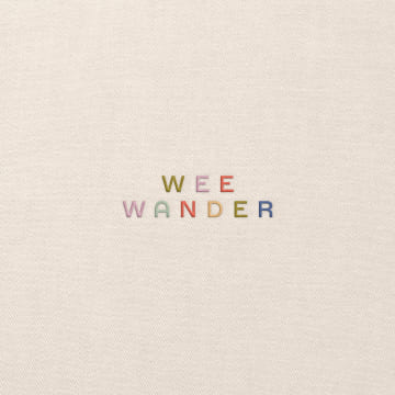 WeeWander brand logo text in earthy green and pink tones on cream textured background