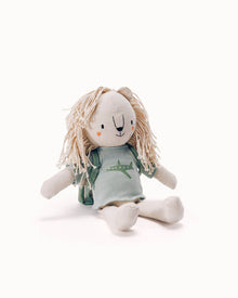 WeeWander Kabo the Lion stuffed animal with yarn mane wearing green shirt with airplane design